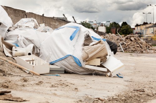 Close-up of labelled waste bags and recyclable materials ready for disposal in Mortlake