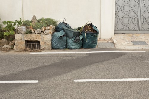 Waste clearance truck at a construction site